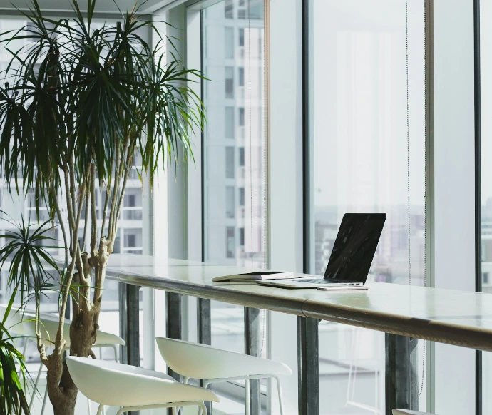 turned off laptop computer on top of brown wooden table